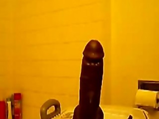 Horny black girl rides huge dildo