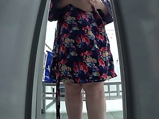 Hidden camera in a cubicle in a public locker room caught a fat mommy with an appetizing booty and saggy tits in her lens. Peeping.